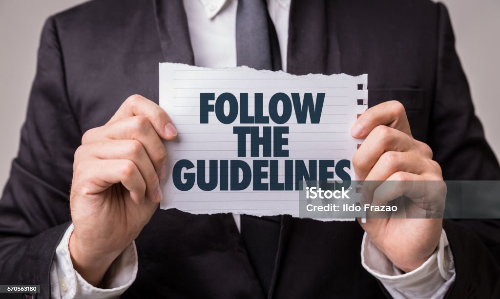 Follow the Guidelines Follow the Guidelines paper sign Instructions Stock Photo