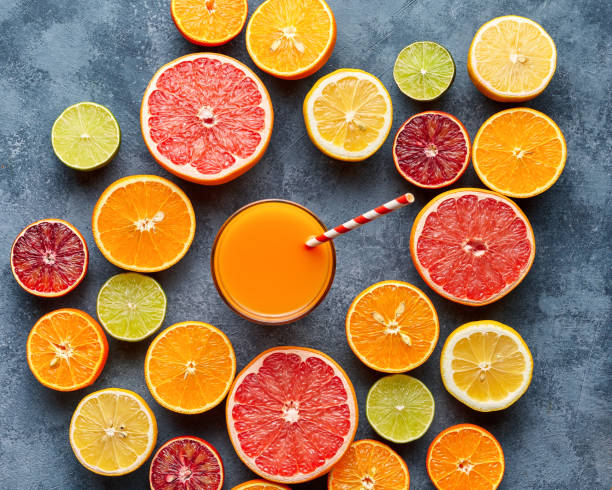 istock Juice with citrus fruit, grapefruit, orange on blue background. Top view, selective focus. Detox, dieting, clean eating, vegetarian, vegan, fitnes healthy concept 670563214