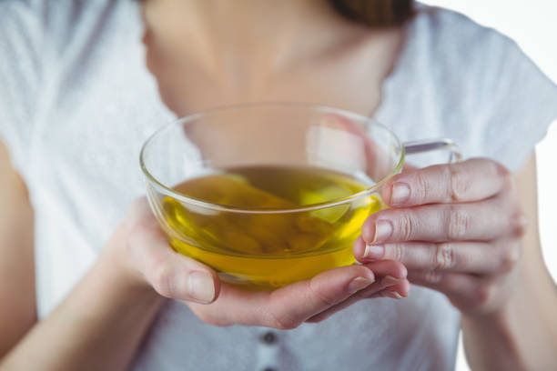 istock Pretty woman with herbal tea 670563398