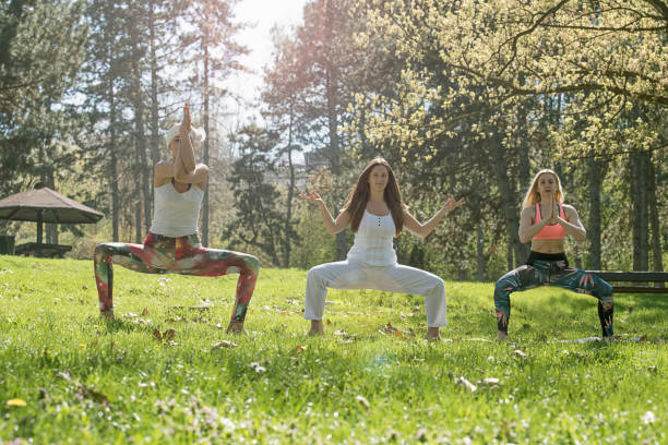 istock Group girl doing yoga 670563810