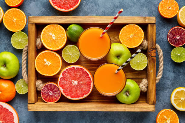 istock Different citrus fruit on a wooden box and grey concrete table. Fruit food background. Healthy eating. Antioxidant, detox, dieting, clean eating, vegetarian, vegan, healthy lifestyle concept 670563940