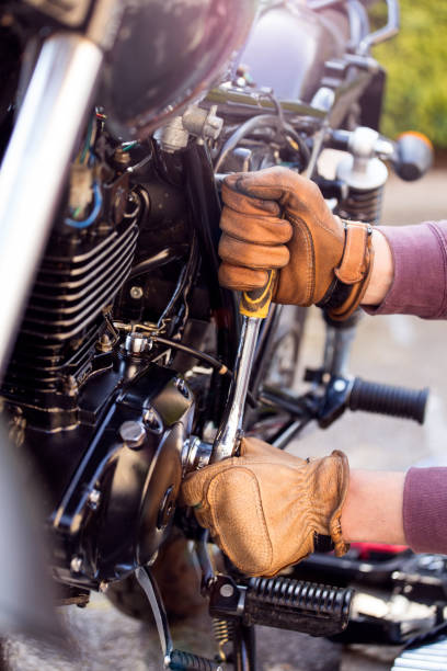 istock Man repairs motorcycle 670564488