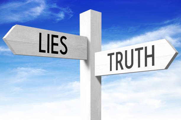 Lies, truth - wooden signpost White wooden signpost/ crossroads sign with two arrows - "lies", "truth". 

 liar stock pictures, royalty-free photos & images