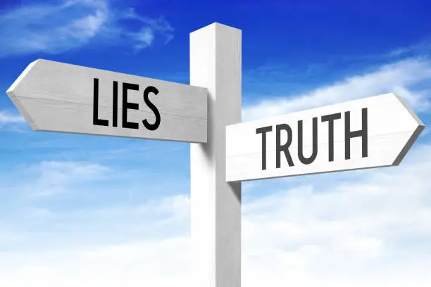 Photo of Lies, truth - wooden signpost