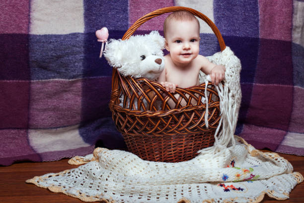 istock Baby in basket with toy 670564966