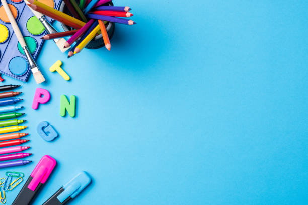 Overhead shot of school supplies on blue background Overhead shot of school supplies on blue background. Close up education horizontal image colors stock pictures, royalty-free photos & images