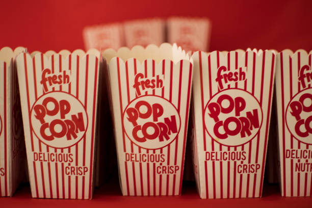 Boxes of Popcorn Various boxes of popcorn lined up for consumption concession stand stock pictures, royalty-free photos & images