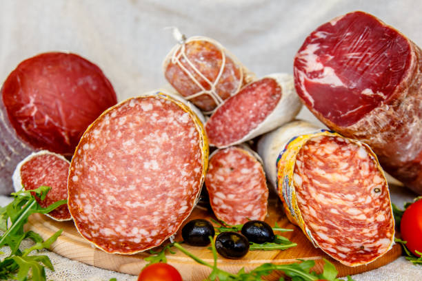 istock Various Italian sausages lying on the counter 670578502