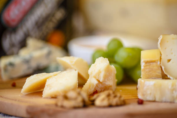 istock Different types of Italian cheeses (Parmesan, Gorgonzola, Roquefort) are on the Board. Macro. 670578596