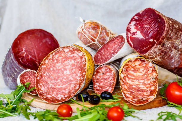 istock Various Italian sausages lying on the counter 670578684