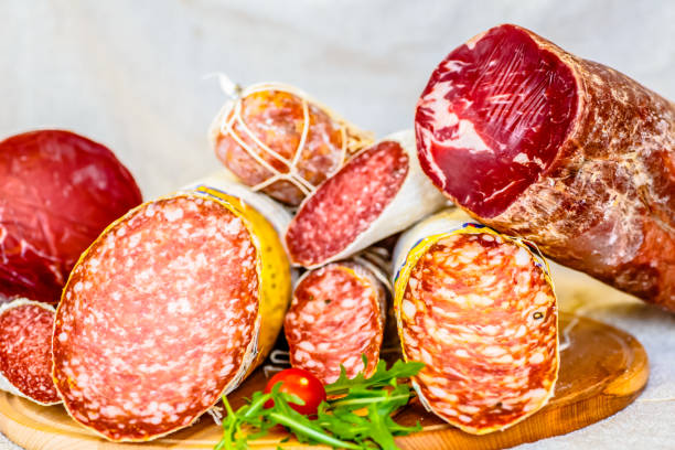 istock Various Italian sausages lying on the counter 670578700