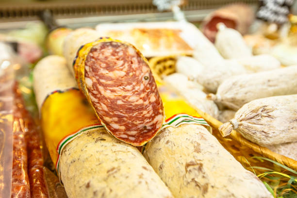 istock Various Italian sausages lying on the counter 670580902