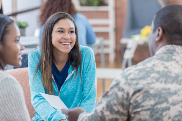 istock Students talk with officer during military recruitment event 670581444