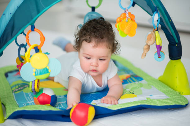 istock Baby boy playing with toys 670581654