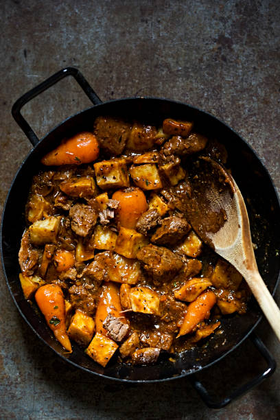 istock Beef red wine casserole with roasted potatoes, carrots, mushrooms 670585260
