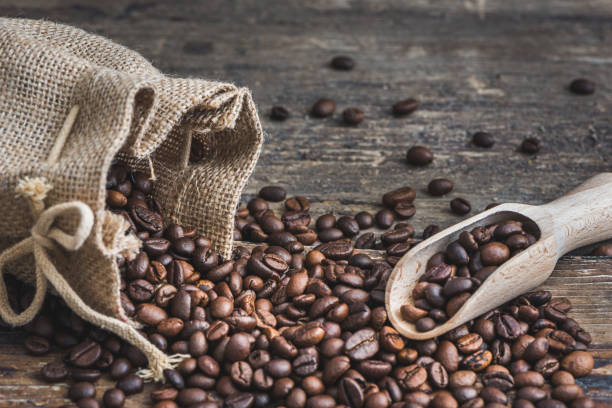 istock Coffee Beans Spilled out of Burlap Sack 670594556