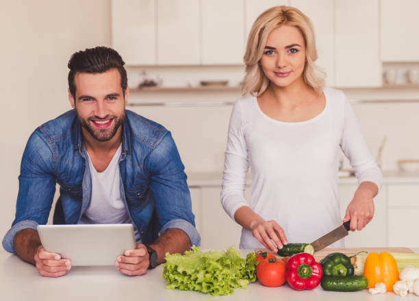 istock Beautiful couple cooking 670594738