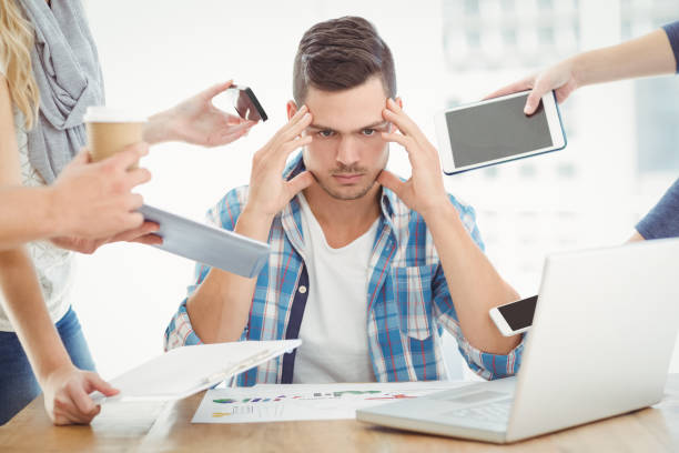 istock Tensed businessman with head in hand 670598148