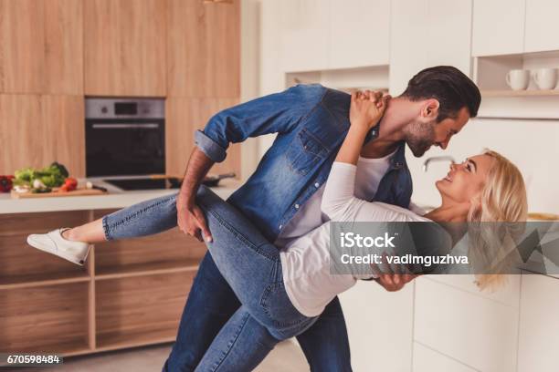 Couple In Kitchen Stock Photo - Download Image Now - Couple - Relationship, Dancing, Young Couple