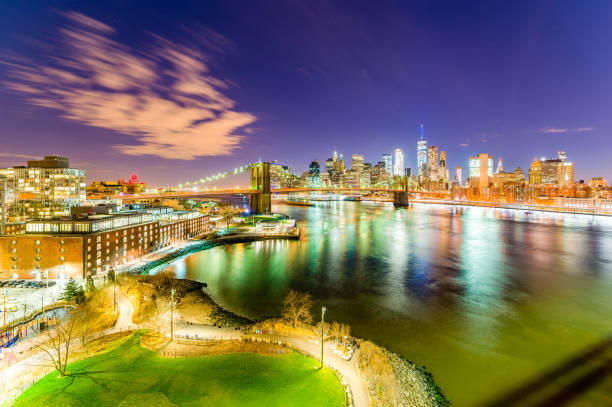 Quiet park in the city The Brooklyn Bridge Park is quite and beautiful at night. The Brooklyn Bridge, the East river and the One World Trade Center can be seen. new york marathon photos stock pictures, royalty-free photos & images