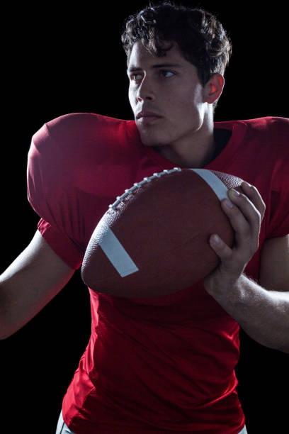 istock Confident American football player playing 670607100