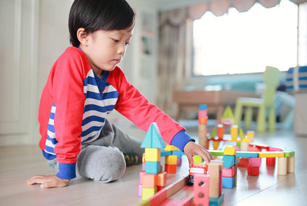 istock Cute asian Children playing with blocks 670611130