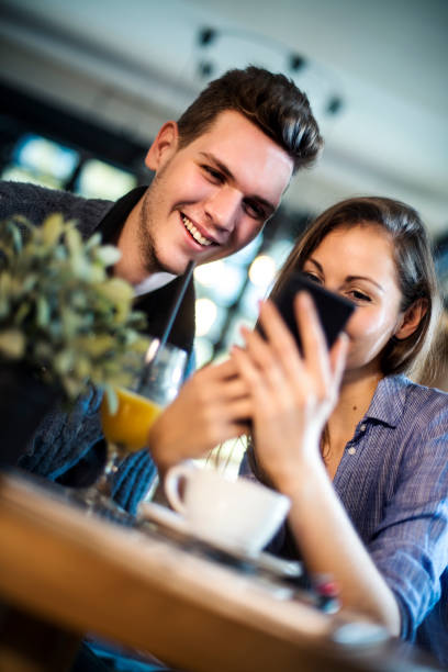 istock Friends chatting and sharing content in cafe 670613832