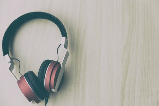 istock Wood office desk with headphone. top veiw with copy space 670614164