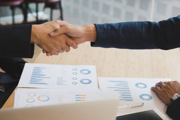 istock businessman handshaking after meeting in office - teamwork, cooperation, agreement, acquisition concept 670614348