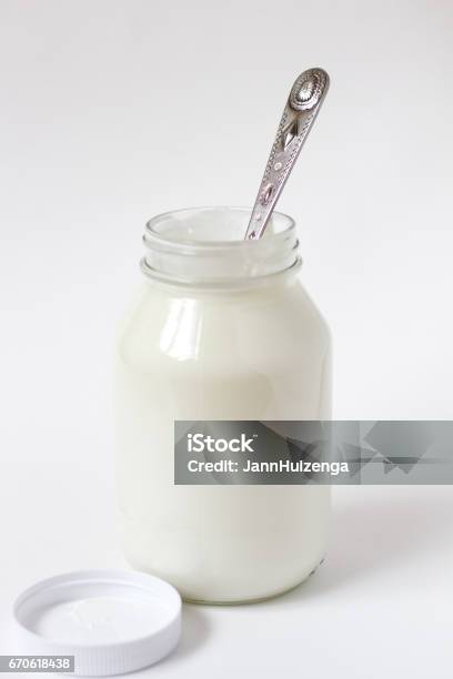 https://media.istockphoto.com/id/670618438/photo/glass-jar-of-greek-yogurt-white-background-spoon-inside.jpg?s=612x612&w=is&k=20&c=O_od3CgTT-FalcVHZBfS4QpJo50BKEqTNAF8OfHWBjw=