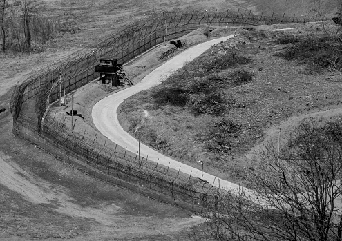 Fences mark the border between North Korea (right) and South Korea (left) in the Demilitarized Zone along the 38th Parallel