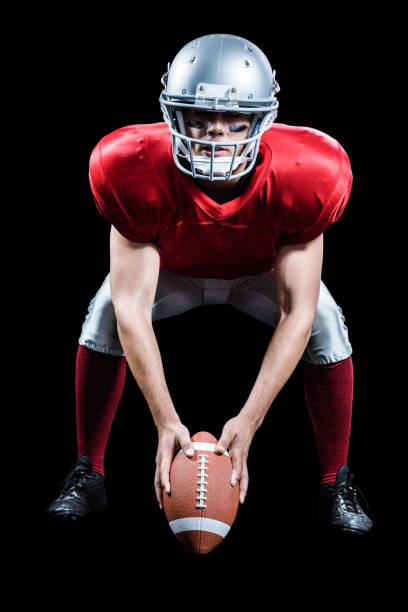 istock Sportsman placing American football while playing 670622110