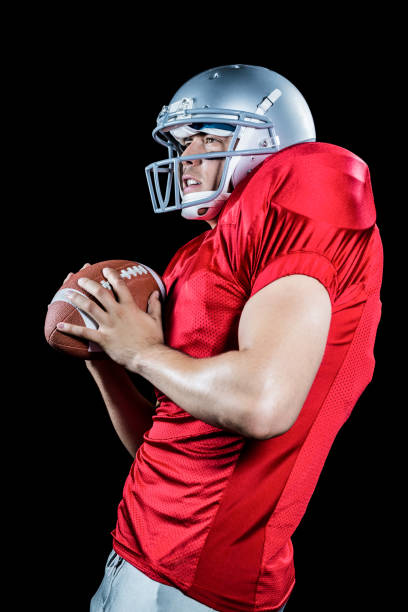istock American football player catching ball 670622534