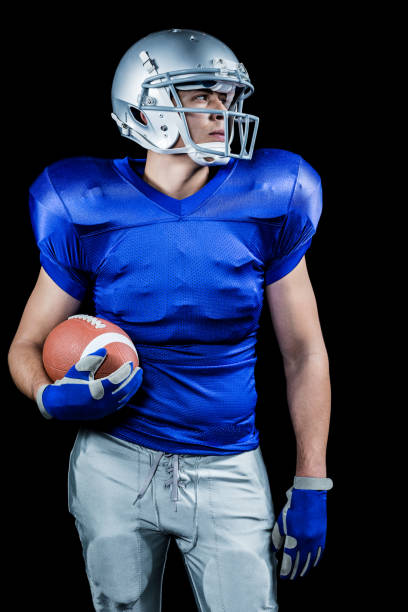 istock Confident American football player looking away 670625658