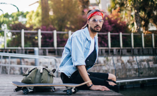 istock Skater relaxing outdoors 670631152