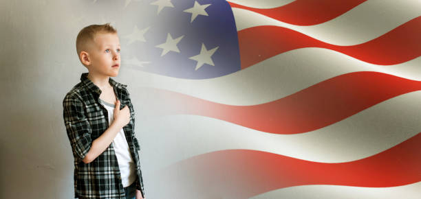 istock Little boy and American flag 670631700