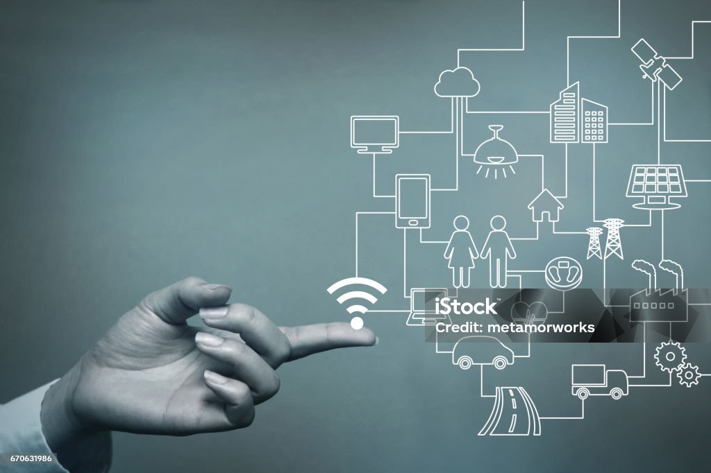 human hand and connected icons of IoT, abstract concept visual Internet of Things Stock Photo