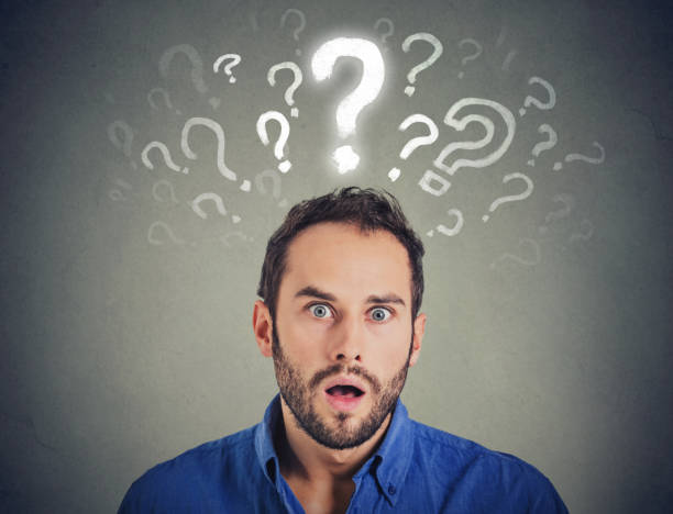 istock Shocked young man with many questions and no explanation or answer 670634814