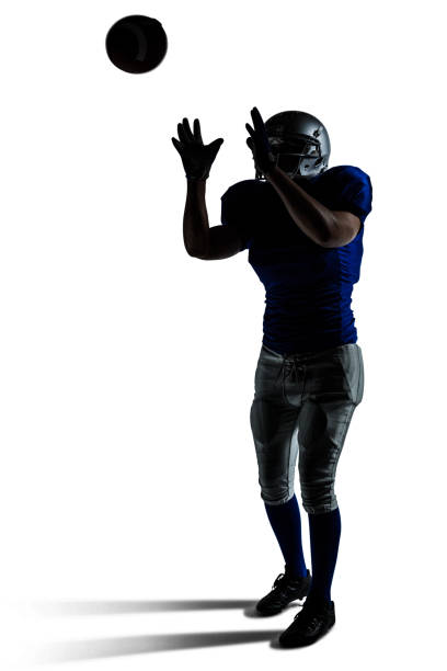 istock American football player catching ball 670641642