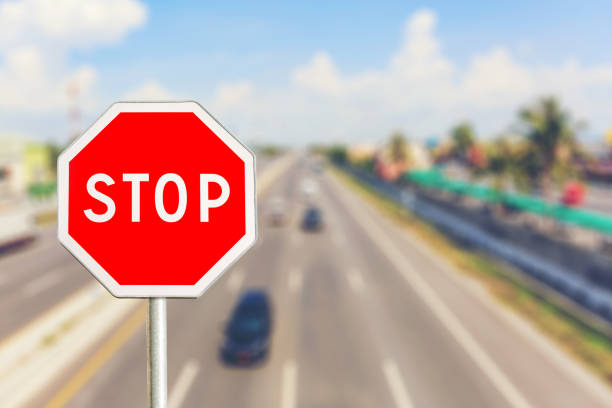 istock Stop sign by the Highway road 670648398