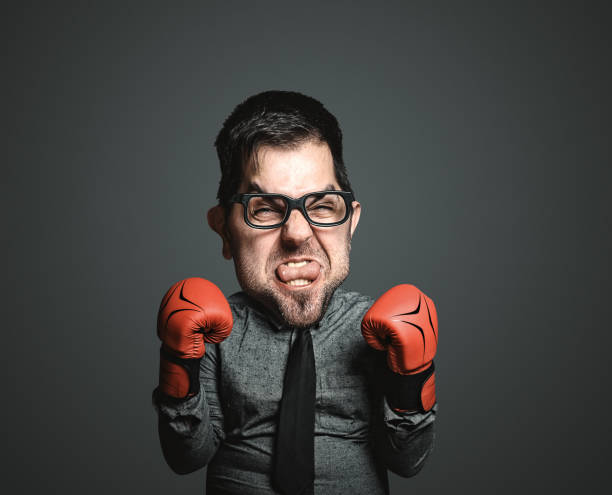 istock Power of funny businessman on blackboard 670649220