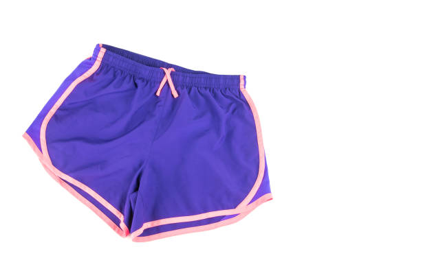 weibliche training shorts auf weißem hintergrund. - nylon legs stock-fotos und bilder
