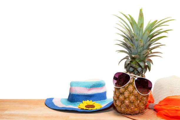 pineapple with sunglasses and hat beach on wood,concept summer background