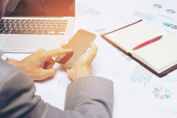 istock Young businessman working at office, writes marketing plans 670668652