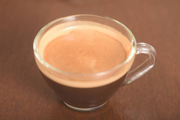 Cup of coffee on wooden table ready to drink