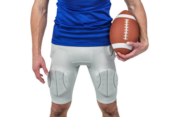 sports player holding ball - football player imagens e fotografias de stock