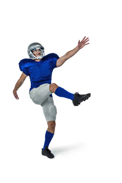 istock American football player kicking 670674964