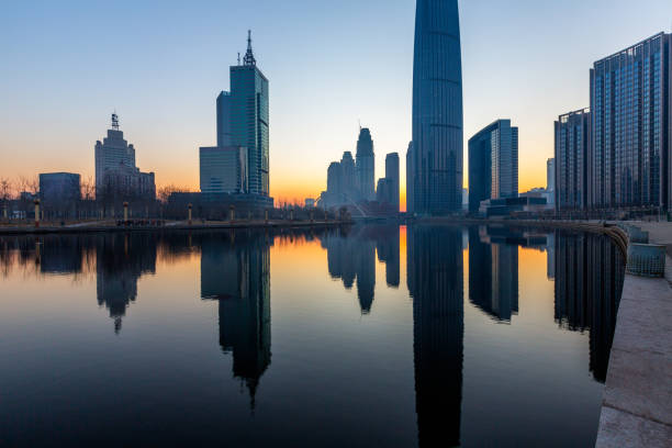 istock River And Modern Buildings Against Sky at dusk 670677412