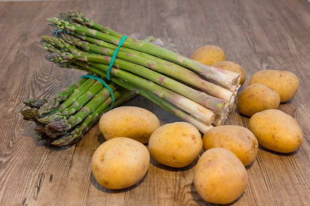 Green asparagus Green asparagus and some potatoes asparagus organic dinner close to stock pictures, royalty-free photos & images