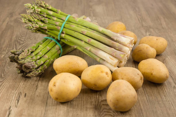 Green asparagus Green asparagus and some potatoes asparagus organic dinner close to stock pictures, royalty-free photos & images